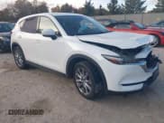✅ 2019 Mazda CX-5 Grand Touring • VIN: JM3KFBDM1K0650496 • Lot: 43483224. Listed on IAAI with 107,358 mi. Free auction sales archive from the USA and detailed vehicle history report at DreamBid. Image 1.