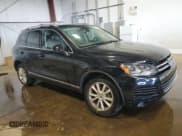 ✅ 2013 Volkswagen Touareg Lux • VIN: WVGEF9BP7DD007945 • Lot: 65758255. Listed on Copart with 90,086 mi. Free auction sales archive from the USA and detailed vehicle history report at DreamBid. Image 4.