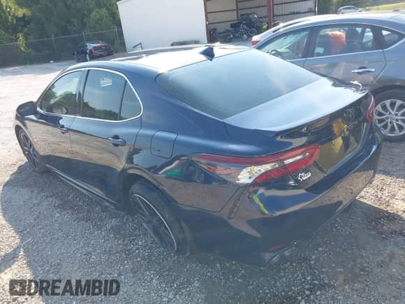 2021 Toyota Camry XSE with VIN 4T1K61AK4MU615383, listed as a IAAI auction lot 43193305 with 57,706 mi miles and . Bid and sale history available at DreamBid. Image 3.