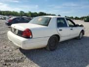 ✅ 2001 Ford Crown Victoria Police Interceptor • VIN: 2FAFP71W21X196551 • Lot: 67838894. Listed on Copart with 79,864 mi. Free auction sales archive from the USA and detailed vehicle history report at DreamBid. Image 3.