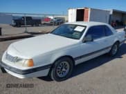 ✅ 1988 Ford Thunderbird • VIN: 1FABP6046JH181589 • Lot: 43096217. Listed on IAAI with 102,307 mi. Free auction sales archive from the USA and detailed vehicle history report at DreamBid. Image 2.