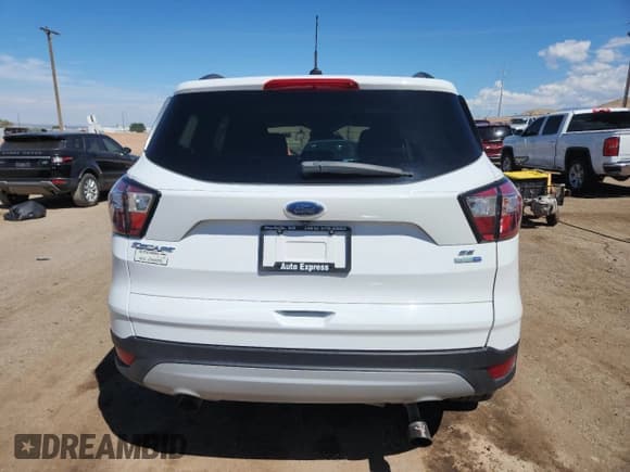✅ 2018 Ford Escape SE • VIN: 1FMCU9GD1JUB01911 • Lot: 80621525. Wystawiony na Copart z przebiegiem 91 262 mil. Bezpłatny archiwum sprzedaży aukcyjnych z USA i szczegółowy raport historii pojazdu na DreamBid. Zdjęcie 6.