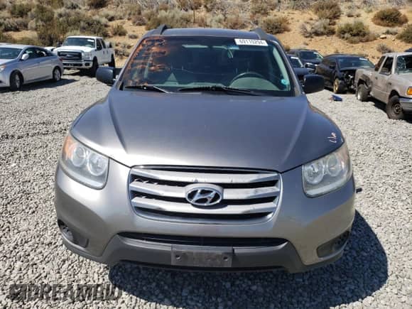 2012 Hyundai Santa Fe GLS с VIN 5XYZGDAB8CG160104, выставлен на аукционе Copart как лот 69110294 с пробегом 141 325 миль миль и Списание • Salvage title. История ставок и продаж доступна на DreamBid. Изображение 5.