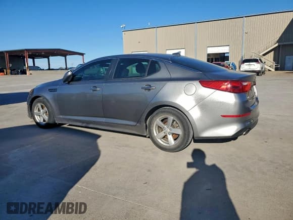 ✅ 2015 Kia Optima LX • VIN: 5XXGM4A77FG466439 • Lot: 94572025. Listed on Copart with 128,472 mi. Free auction sales archive from the USA and detailed vehicle history report at DreamBid. Image 2.