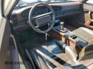 ✅ 1986 Porsche 944 • VIN: WP0AA0946GN454841 • Lot: 71168965. Wystawiony na Copart z przebiegiem 127 917 mil. Bezpłatny archiwum sprzedaży aukcyjnych z USA i szczegółowy raport historii pojazdu na DreamBid. Zdjęcie 8.