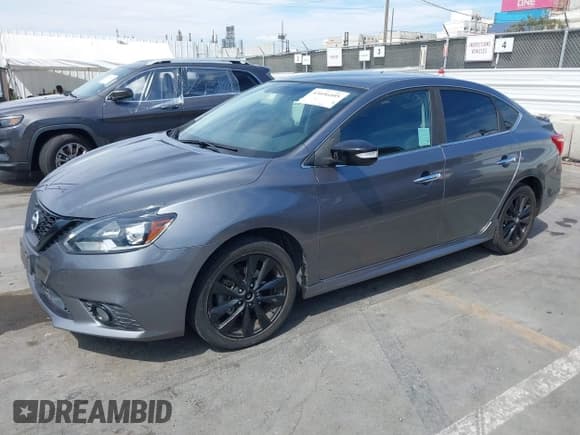 ✅ 2018 Nissan Sentra S • VIN: 3N1AB7AP3JY231696 • Лот: 43056405. Опубликован ранее на IAAI с пробегом 124 253 миль. Бесплатный доступ к архиву аукционных продаж из США и подробный отчёт об истории автомобиля на DreamBid. Изображение 2.