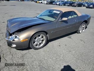✅ 2001 Jaguar XK • VIN: SAJDA42C51NA18077 • Lot: 82308645. Wystawiony na Copart z przebiegiem 89 415 mil. Bezpłatny archiwum sprzedaży aukcyjnych z USA i szczegółowy raport historii pojazdu na DreamBid. Zdjęcie 1.