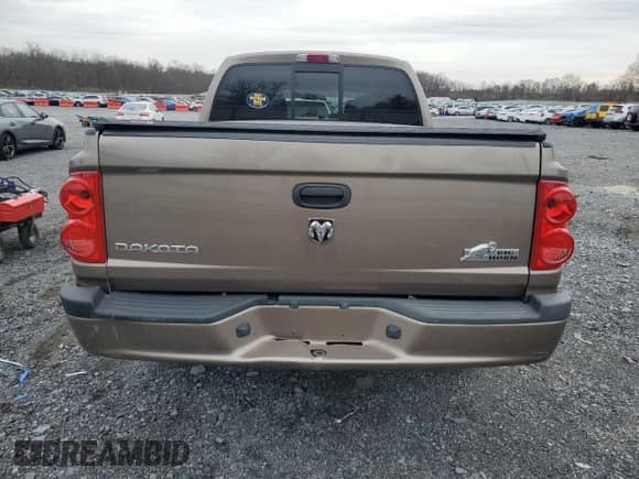 2010 Dodge Dakota Bighorn/Lonestar z VIN 1D7CW3GK3AS176153, wystawiony jako Copart lot #80619634 z przebiegiem 73 875 mil mil oraz Szkoda całkowita • Salvage title. Historia ofert i sprzedaży dostępna na DreamBid. Obrazek 6.