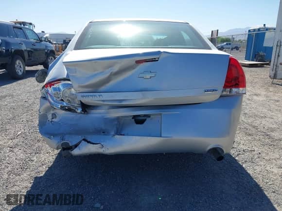 2013 Chevrolet Impala LS z VIN 2G1WF5E35D1265220, wystawiony jako IAAI lot #42559869 z przebiegiem 124 046 mil mil oraz . Historia ofert i sprzedaży dostępna na DreamBid. Obrazek 6.