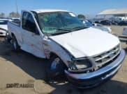 ✅ 1997 Ford F-150 • VIN: 1FTDF17WXVLA71129 • Lot: 43617497. Listed on IAAI with 230,491 mi. Free auction sales archive from the USA and detailed vehicle history report at DreamBid. Image 1.