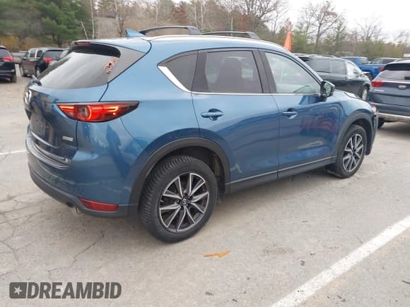 ✅ 2017 Mazda CX-5 Grand Touring • VIN: JM3KFBDL7H0141870 • Lot: 43597912. Wystawiony na IAAI z przebiegiem 105 742 mil. Bezpłatny archiwum sprzedaży aukcyjnych z USA i szczegółowy raport historii pojazdu na DreamBid. Zdjęcie 4.