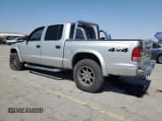 ✅ 2004 Dodge Dakota SLT • VIN: 1D7HG48N74S509797 • Lot: 57797055. Wystawiony na Copart z przebiegiem 214 275 mil. Bezpłatny archiwum sprzedaży aukcyjnych z USA i szczegółowy raport historii pojazdu na DreamBid. Zdjęcie 2.