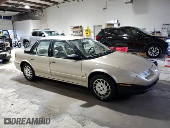 1995 Saturn SL с VIN 1G8ZK5271SZ238117, выставлен на аукционе Copart как лот 83723624 с пробегом 80 535 миль миль и Чистый • Clean title. История ставок и продаж доступна на DreamBid. Изображение 4.