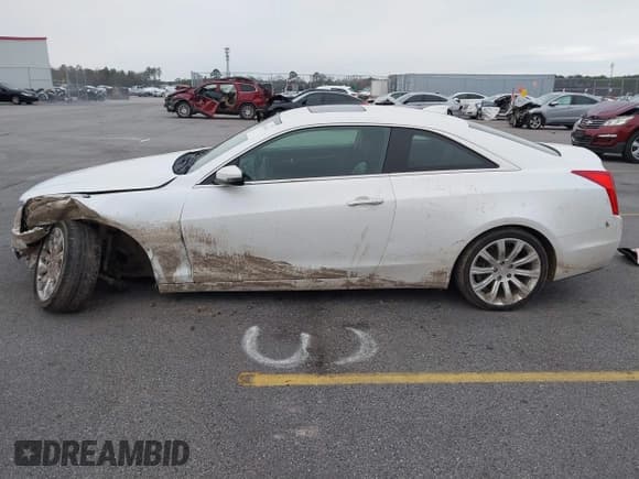 ✅ 2015 Cadillac ATS Standard AWD • VIN: 1G6AG1RX0F0127073 • Lot: 41296448. Listed on IAAI with 119,718 mi. Free auction sales archive from the USA and detailed vehicle history report at DreamBid. Image 14.