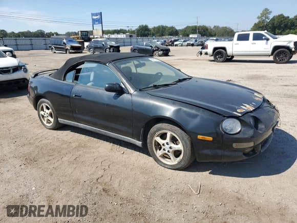✅ 1998 Toyota Celica GT • VIN: JT5FG02T9W0049697 • Lot: 80792425. Listed on Copart with 128,879 mi. Free auction sales archive from the USA and detailed vehicle history report at DreamBid. Image 4.