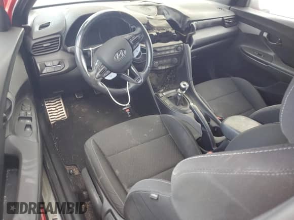 2020 Hyundai Veloster z VIN KMHT36AH2LU003485, wystawiony jako Copart lot #76160994 z przebiegiem Nie podano mil oraz Szkoda całkowita • Salvage title. Historia ofert i sprzedaży dostępna na DreamBid. Obrazek 8.