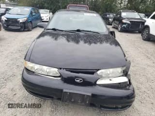 ✅ 2000 Oldsmobile Alero GX • VIN: 1G3NK52TXYC321347 • Лот: 67175124. Опубликован ранее на Copart с пробегом Не указан. Бесплатный доступ к архиву аукционных продаж из США и подробный отчёт об истории автомобиля на DreamBid. Изображение 5.