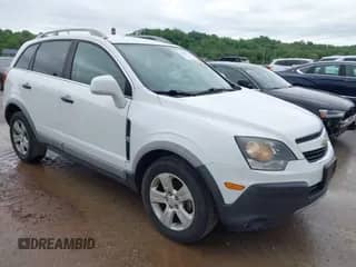 2015 Chevrolet Captiva Sport LS z VIN 3GNAL2EK2FS506410, wystawiony jako IAAI lot #42180711 z przebiegiem 154 228 mil mil oraz . Historia ofert i sprzedaży dostępna na DreamBid. Obrazek 1.