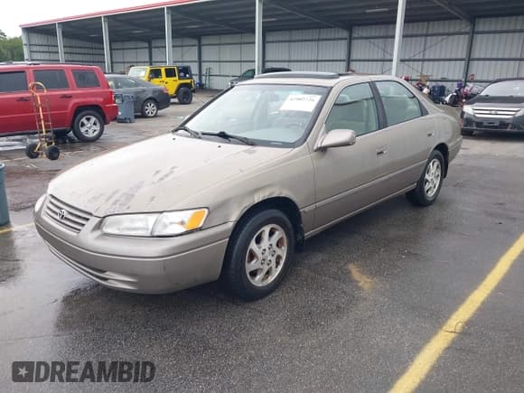 ✅ 1999 Toyota Camry LE • VIN: JT2BF22K9X0226073 • Lot: 42902726. Listed on IAAI with 264,241 mi. Free auction sales archive from the USA and detailed vehicle history report at DreamBid. Image 2.