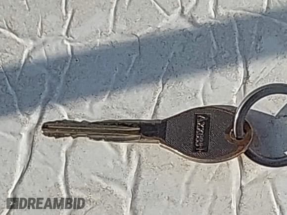 ✅ 2015 Nissan Versa SV • VIN: 3N1CN7AP1FL891725 • Лот: 42852838. Опубликован ранее на IAAI с пробегом 128 362 миль. Бесплатный доступ к архиву аукционных продаж из США и подробный отчёт об истории автомобиля на DreamBid. Изображение 11.