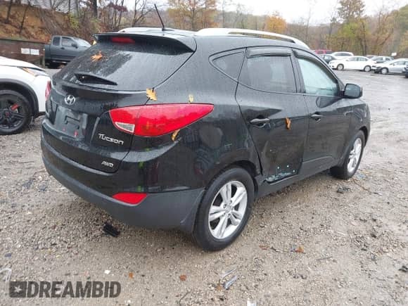 2010 Hyundai Tucson GLS with VIN KM8JUCAC8AU042134, listed as a IAAI auction lot 43564698 with 77,937 mi miles and . Bid and sale history available at DreamBid. Image 4.