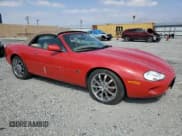 ✅ 1999 Jaguar XK • VIN: SAJGX2044XC038236 • Lot: 81923635. Listed on Copart with 44,616 mi. Free auction sales archive from the USA and detailed vehicle history report at DreamBid. Image 4.