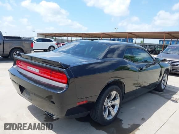 ✅ 2014 Dodge Challenger SXT • VIN: 2C3CDYAG9EH136646 • Lot: 42542559. Listed on IAAI with 169,334 mi. Free auction sales archive from the USA and detailed vehicle history report at DreamBid. Image 4.