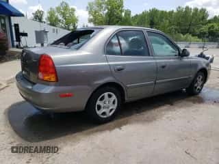 2005 Hyundai Accent GLS z VIN KMHCG45C45U645068, wystawiony jako Copart lot #63000715 z przebiegiem 205 762 mil mil oraz Nie do naprawy • Non repairable. Historia ofert i sprzedaży dostępna na DreamBid. Obrazek 3.