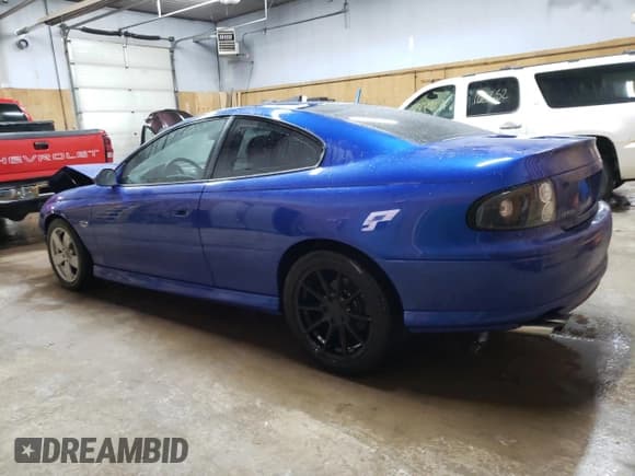 ✅ 2004 Pontiac GTO • VIN: 6G2VX12G94L209153 • Lot: 77960994. Listed on Copart with 52,868 mi. Free auction sales archive from the USA and detailed vehicle history report at DreamBid. Image 2.