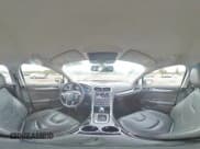 ✅ 2013 Ford Fusion Titanium Hybrid • VIN: 3FA6P0RU0DR308700 • Лот: 80861785. Опубликован ранее на Copart с пробегом 105 588 миль. Бесплатный доступ к архиву аукционных продаж из США и подробный отчёт об истории автомобиля на DreamBid. Изображение 14.