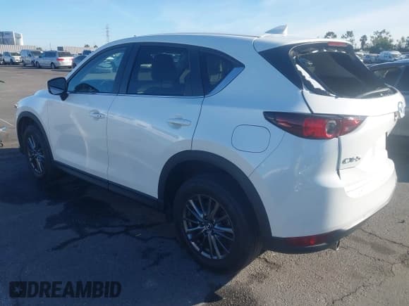 ✅ 2021 Mazda CX-5 Carbon Edition • VIN: JM3KFACM5M0420538 • Lot: 43663563. Listed on IAAI with 50,733 mi. Free auction sales archive from the USA and detailed vehicle history report at DreamBid. Image 3.