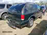 2002 Chevrolet Blazer LS z VIN 1GNCT18W52K187799, wystawiony jako Copart lot #73642634 z przebiegiem Nie podano mil oraz Szkoda całkowita • Salvage title. Historia ofert i sprzedaży dostępna na DreamBid. Obrazek 3.