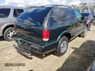 2002 Chevrolet Blazer LS z VIN 1GNCT18W52K187799, wystawiony jako Copart lot #73642634 z przebiegiem Nie podano mil oraz Szkoda całkowita • Salvage title. Historia ofert i sprzedaży dostępna na DreamBid. Obrazek 3.