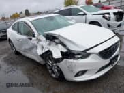 ✅ 2014 Mazda 6 i Grand Touring • VIN: JM1GJ1W67E1118643 • Lot: 43604649. Listed on IAAI with 147,515 mi. Free auction sales archive from the USA and detailed vehicle history report at DreamBid. Image 1.