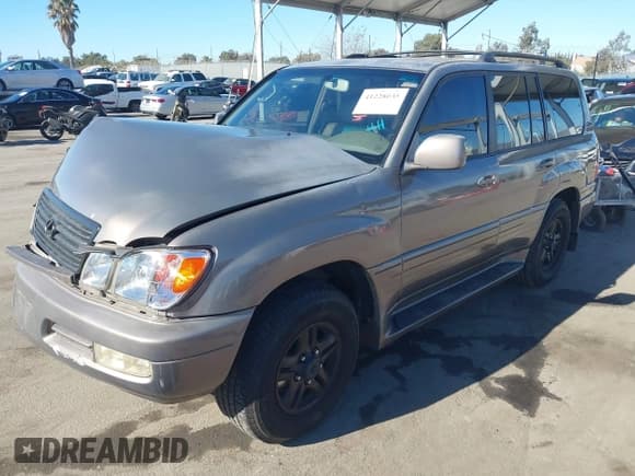 ✅ 1999 Lexus LX 470 • VIN: JT6HT00W5X0075986 • Lot: 41228035. Listed on IAAI with 163,548 mi. Free auction sales archive from the USA and detailed vehicle history report at DreamBid. Image 2.