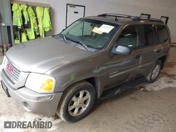 ✅ 2006 GMC Envoy SLE • VIN: 1GKDT13S762250462 • Lot: 42521572. Listed on IAAI with 282,232 mi. Free auction sales archive from the USA and detailed vehicle history report at DreamBid. Image 2.