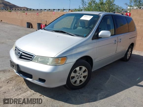 ✅ 2004 Honda Odyssey EX-RES • VIN: 5FNRL18874B089202 • Lot: 43184759. Listed on IAAI with 102,400 mi. Free auction sales archive from the USA and detailed vehicle history report at DreamBid. Image 2.