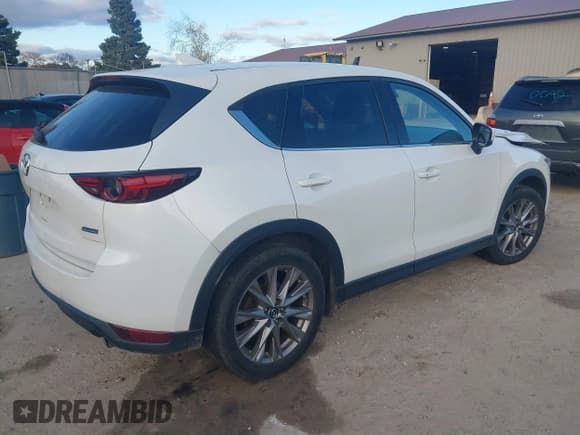 ✅ 2019 Mazda CX-5 Grand Touring • VIN: JM3KFBDM1K0650496 • Lot: 43483224. Listed on IAAI with 107,358 mi. Free auction sales archive from the USA and detailed vehicle history report at DreamBid. Image 4.
