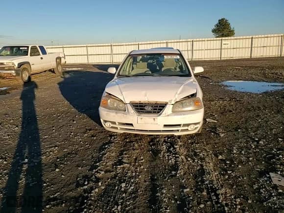 2004 Hyundai Elantra GLS z VIN KMHDN46D54U795500, wystawiony jako Copart lot #79738314 z przebiegiem 119 167 mil mil oraz Szkoda całkowita • Salvage title. Historia ofert i sprzedaży dostępna na DreamBid. Obrazek 11.