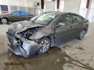 ✅ 2021 Toyota Prius LE • VIN: JTDL9MFU2M3023742 • Lot: 82576745. Listed on Copart with 121,819 mi. Free auction sales archive from the USA and detailed vehicle history report at DreamBid. Image 1.