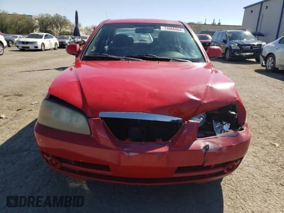 2004 Hyundai Elantra GLS z VIN KMHDN46D74U798303, wystawiony jako Copart lot #74066864 z przebiegiem 104 136 mil mil oraz Szkoda całkowita • Salvage title. Historia ofert i sprzedaży dostępna na DreamBid. Obrazek 5.