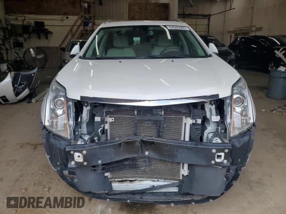 ✅ 2016 Cadillac SRX Premium Collection • VIN: 3GYFNDE34GS552894 • Lot: 64945985. Listed on Copart with 105,751 mi. Free auction sales archive from the USA and detailed vehicle history report at DreamBid. Image 5.