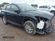 ✅ 2014 Mazda CX-5 Sport • VIN: JM3KE4BE4E0399648 • Lot: 42452015. Listed on IAAI with 105,621 mi. Free auction sales archive from the USA and detailed vehicle history report at DreamBid. Image 1.