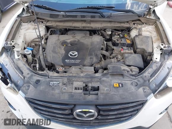 ✅ 2016 Mazda CX-5 Touring • VIN: JM3KE2CY0G0694939 • Lot: 43401057. Wystawiony na IAAI z przebiegiem 125 867 mil. Bezpłatny archiwum sprzedaży aukcyjnych z USA i szczegółowy raport historii pojazdu na DreamBid. Zdjęcie 10.