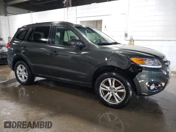 ✅ 2012 Hyundai Santa Fe SE • VIN: 5XYZH4AG3CG117525 • Lot: 75181374. Listed on Copart with 96,764 mi. Free auction sales archive from the USA and detailed vehicle history report at DreamBid. Image 4.