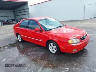 ✅ 2002 Kia Spectra GS • VIN: KNAFB161X25089511 • Lot: 42497052. Listed on IAAI with 262,867 mi. Free auction sales archive from the USA and detailed vehicle history report at DreamBid. Image 1.