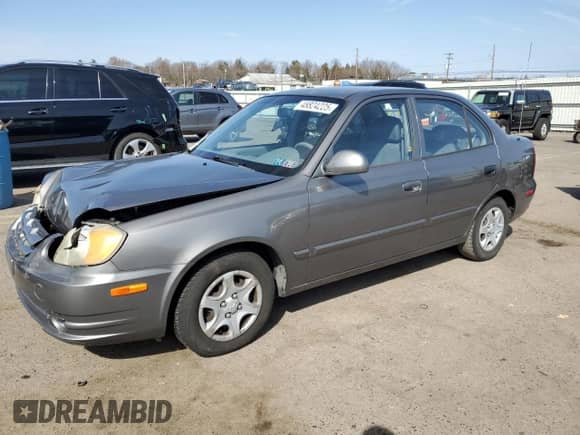 2005 Hyundai Accent GLS z VIN KMHCG45C65U625887, wystawiony jako Copart lot #48824225 z przebiegiem 110 594 mil mil oraz Szkoda całkowita • Salvage title. Historia ofert i sprzedaży dostępna na DreamBid. Obrazek 1.