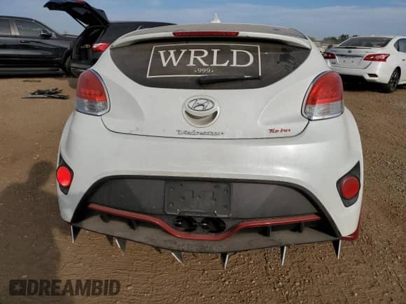 2013 Hyundai Veloster Turbo z VIN KMHTC6AE1DU126220, wystawiony jako Copart lot #71816384 z przebiegiem 128 943 mil mil oraz Szkoda całkowita • Salvage title. Historia ofert i sprzedaży dostępna na DreamBid. Obrazek 6.
