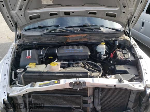 2005 Dodge 1500 SLT z VIN 1D7HU18N85S303218, wystawiony jako Copart lot #68878684 z przebiegiem 244 007 mil mil oraz Szkoda całkowita • Salvage title. Historia ofert i sprzedaży dostępna na DreamBid. Obrazek 11.