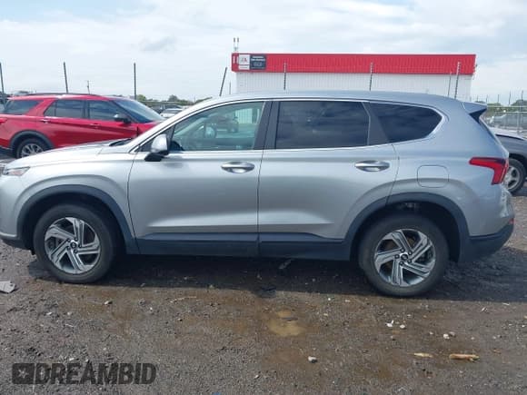 ✅ 2021 Hyundai Santa Fe SE • VIN: 5NMS1DAJ5MH329724 • Lot: 43245906. Listed on IAAI with 67,954 mi. Free auction sales archive from the USA and detailed vehicle history report at DreamBid. Image 14.